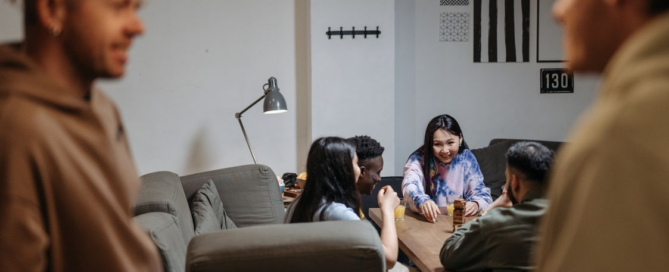 Young adults talking together in a relaxed group setting