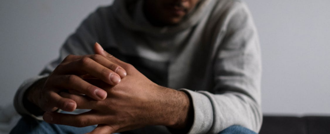 Person reflecting after completing addiction treatment.